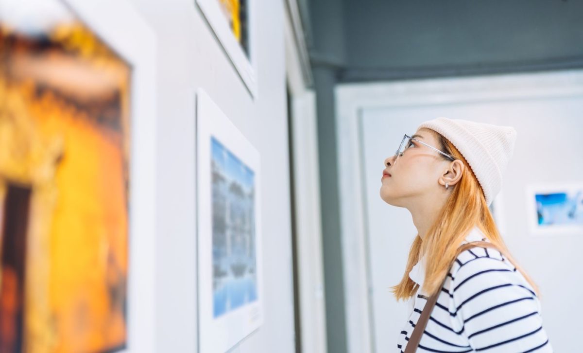 Woman viewing art in a gallery.