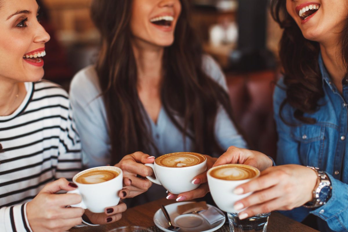 friends drinking coffee at cafe