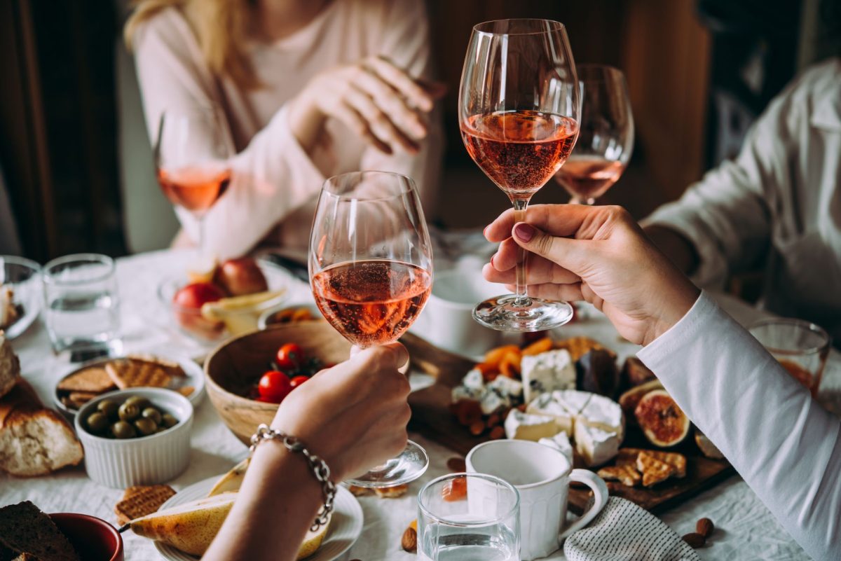 friends clinking wine glasses